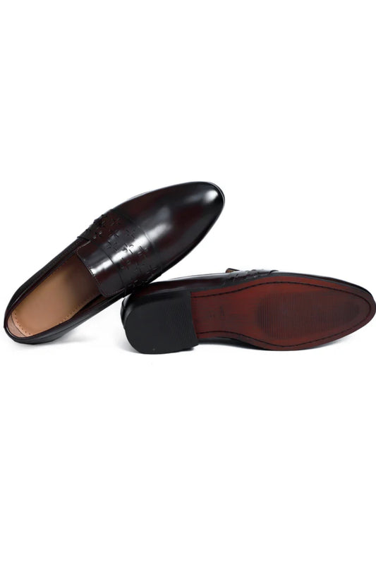 Pair of black dress shoes on a white background