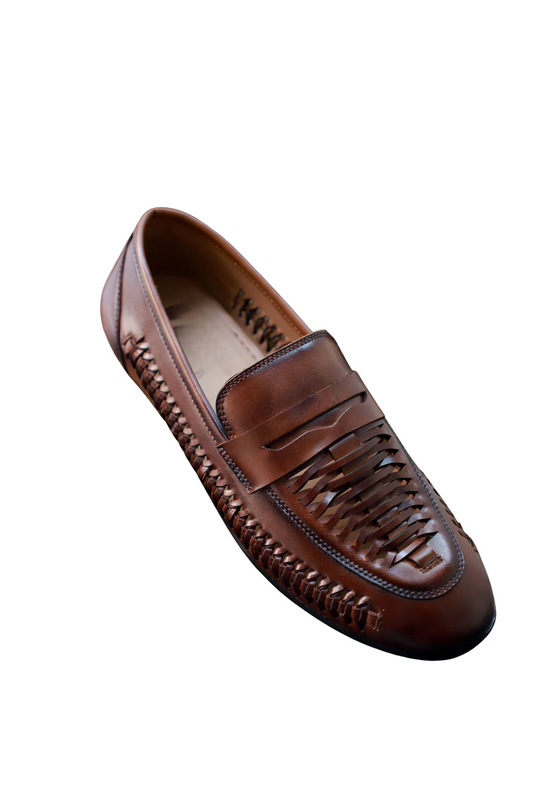 Brown leather loafer shoe on a white background