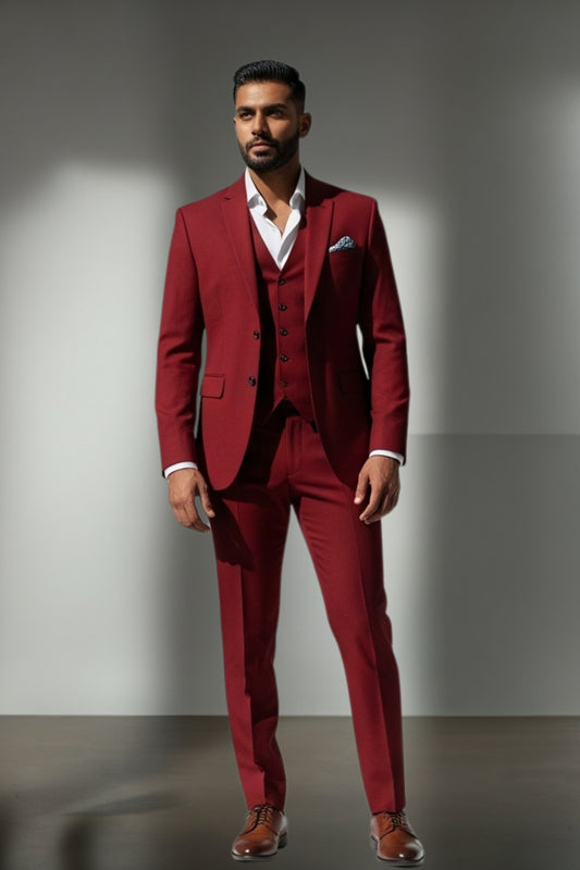 Man wearing a red suit with a white shirt against a gray background