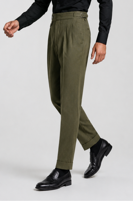 Bespoke Blutailor olive-green Gurkha pant featuring a high-waisted structured fit with adjustable side buckle tabs, tailored pleated front, and tapered leg silhouette.