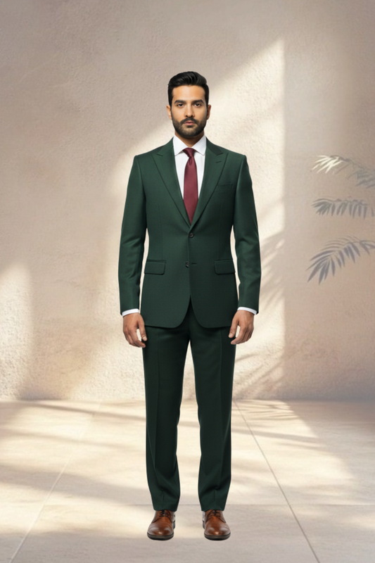 Man wearing a green suit with a red tie against a neutral background