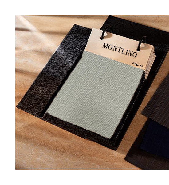 Color swatch book with Montlino branding on a wooden surface