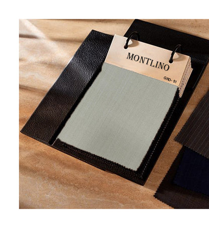 Color swatch book with Montlino branding on a wooden surface