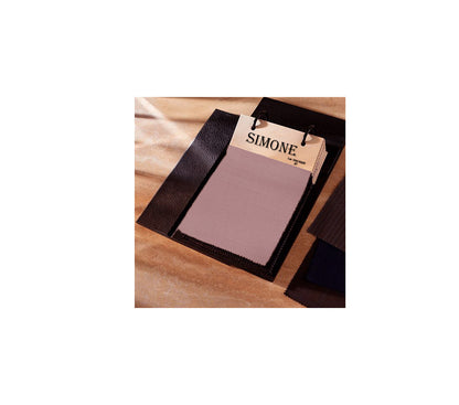 Makeup swatch on a wooden board with 'Simone' label