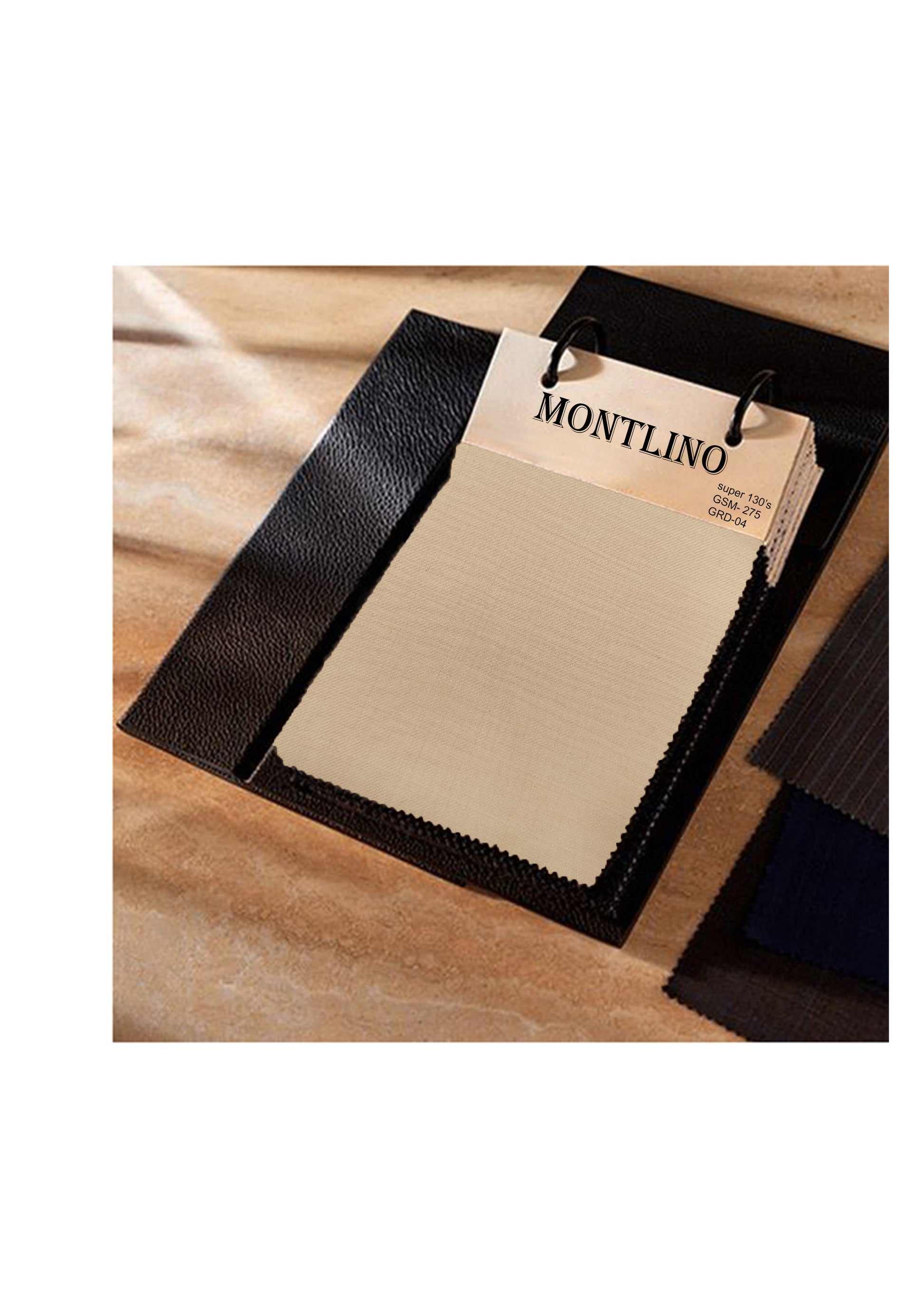 Black leather sample with a 'Montlino' tag on a wooden surface